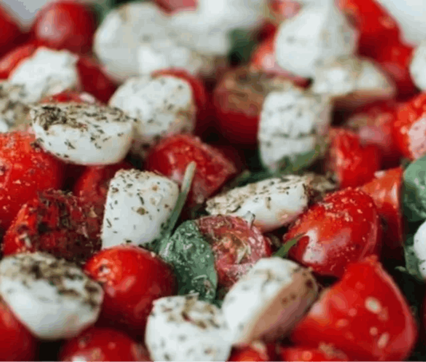 Caprese salad with tomatoes, mozzarella, and basil.