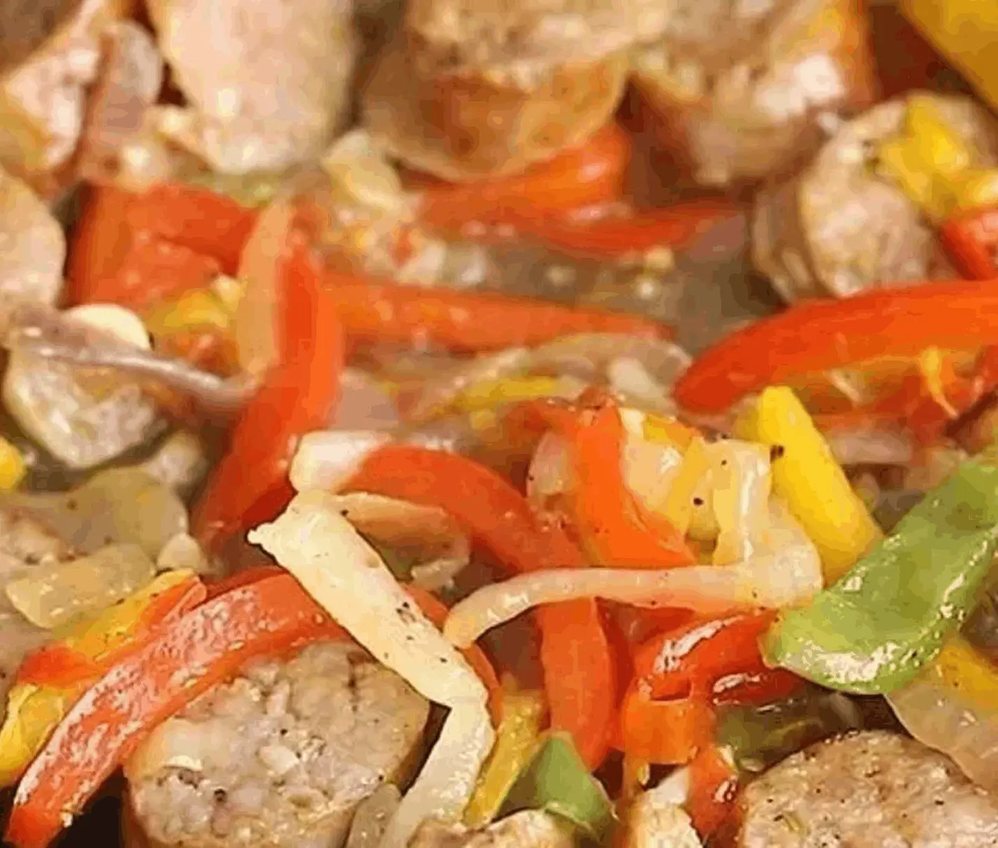 Sausage with colorful bell peppers and onions.