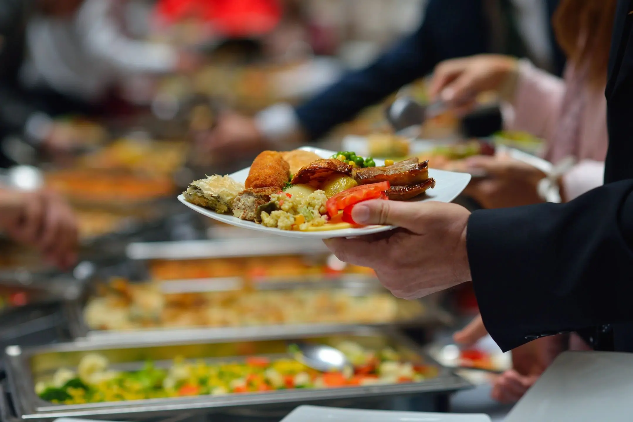 qtq80-1B4SQb Buffet plate with assorted foods being served.