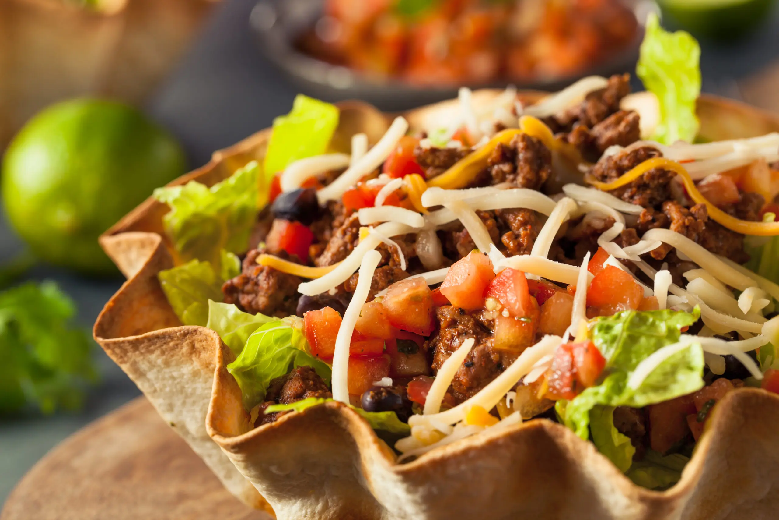 Taco Salad in a Tortilla Bowl with Beef Cheese and Lettuce